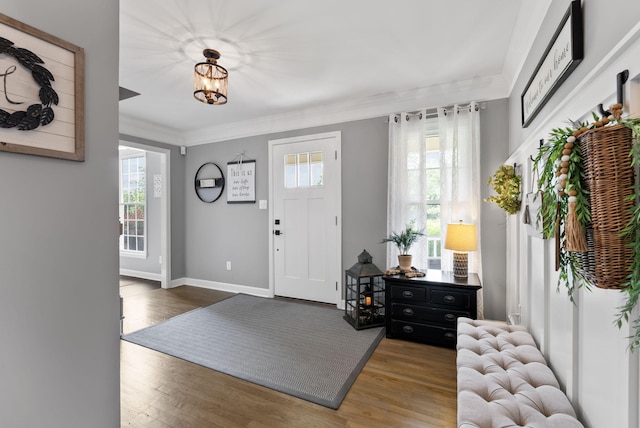4109 Bridgemont Ln, Lexington, KY 40515 - entrance foyer featuring healthy amount of natural light, wood finished floors, crown molding, and a chandelier