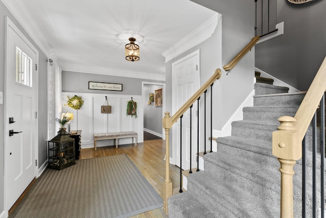 4109 Bridgemont Ln, Lexington, KY 40515 - entrance foyer with crown molding, stairs, and wood finished floors
