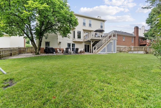 4109 Bridgemont Ln, Lexington, KY 40515 - rear view of house featuring stairway, a deck, a fenced backyard, and a patio