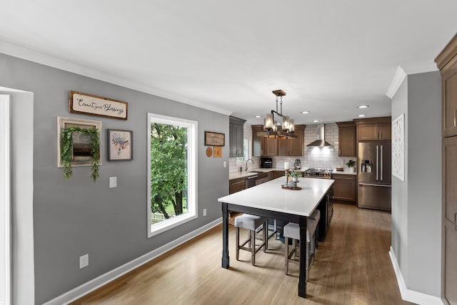 4109 Bridgemont Ln, Lexington, KY 40515 - dining room featuring a chandelier, crown molding, light wood-style floors, and recessed lighting