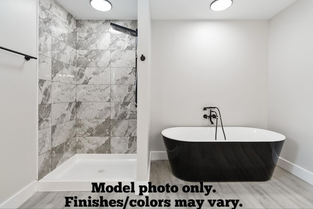 61 Vine St, Corbin, KY 40701 - bathroom with a freestanding bath, wood finished floors, and tiled shower