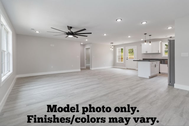 61 Vine St, Corbin, KY 40701 - unfurnished living room with recessed lighting, light wood-style floors, and ceiling fan