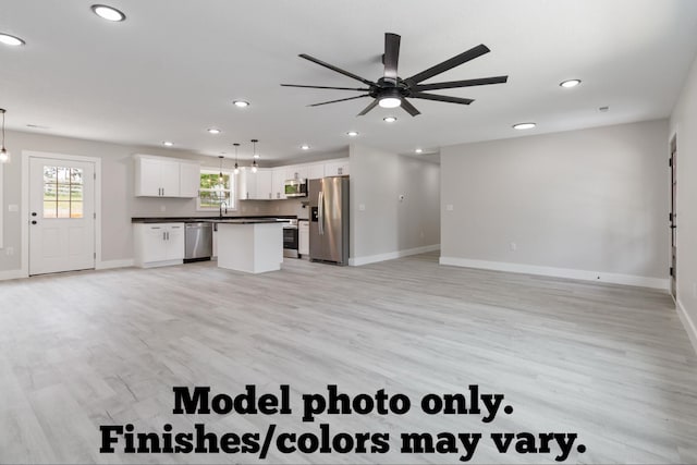 61 Vine St, Corbin, KY 40701 - unfurnished living room with recessed lighting, ceiling fan, and light wood finished floors
