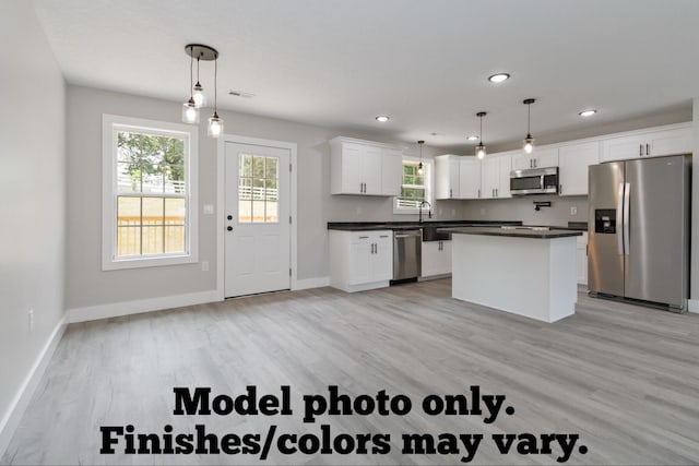 61 Vine St, Corbin, KY 40701 - kitchen with stainless steel appliances, dark countertops, light wood finished floors, white cabinets, and recessed lighting