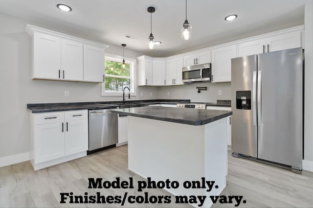 61 Vine St, Corbin, KY 40701 - kitchen with stainless steel appliances, dark countertops, white cabinets, light wood-style floors, and recessed lighting