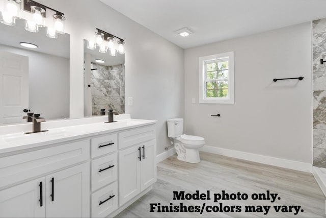 61 Vine St, Corbin, KY 40701 - full bathroom with a tile shower, double vanity, and wood finished floors
