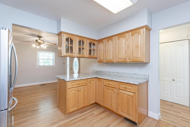 471 Westerfield Way Unit 40503, Lexington, KY 40503 - kitchen featuring stainless steel refrigerator, light wood finished floors, glass insert cabinets, and a peninsula