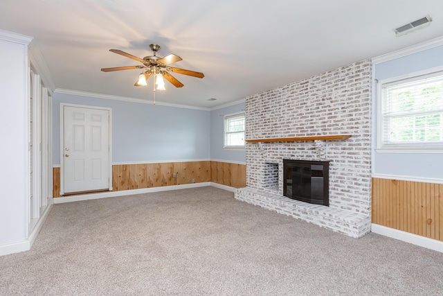 471 Westerfield Way Unit 40503, Lexington, KY 40503 - unfurnished living room with a ceiling fan, carpet floors, a brick fireplace, wainscoting, and crown molding