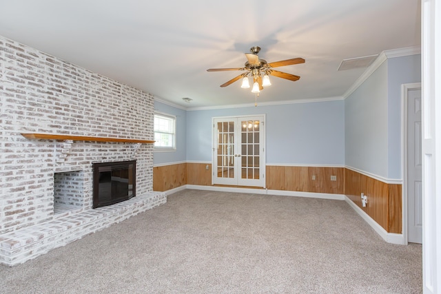 471 Westerfield Way Unit 40503, Lexington, KY 40503 - unfurnished living room featuring a ceiling fan, wainscoting, french doors, carpet, and a fireplace