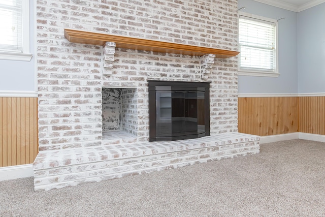 471 Westerfield Way Unit 40503, Lexington, KY 40503 - detailed view of wainscoting, carpet flooring, a brick fireplace, crown molding, and wooden walls