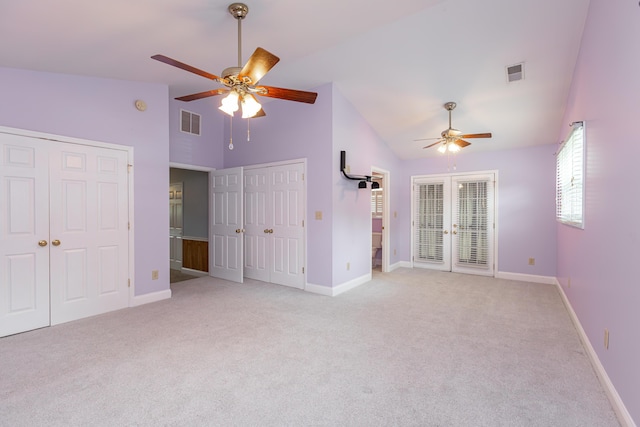 471 Westerfield Way Unit 40503, Lexington, KY 40503 - unfurnished bedroom featuring two closets, french doors, light colored carpet, ceiling fan, and high vaulted ceiling
