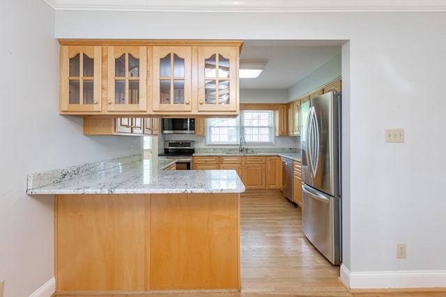 471 Westerfield Way Unit 40503, Lexington, KY 40503 - kitchen featuring stainless steel appliances, a peninsula, light wood-style floors, light stone countertops, and glass insert cabinets