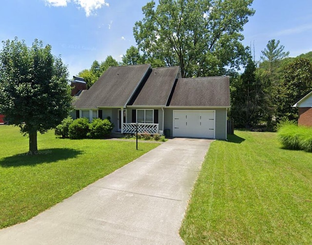 5 Abbey Ln, Middlesboro, KY 40965 - view of front of home with an attached garage, a front lawn, driveway, and a chimney