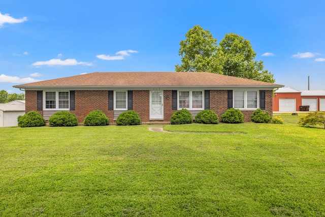 215 New Dixville Rd, Harrodsburg, KY 40330 - ranch-style house featuring a front yard, brick siding, a garage, and roof with shingles