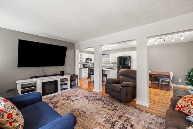 215 New Dixville Rd, Harrodsburg, KY 40330 - living room with light wood finished floors and a textured ceiling
