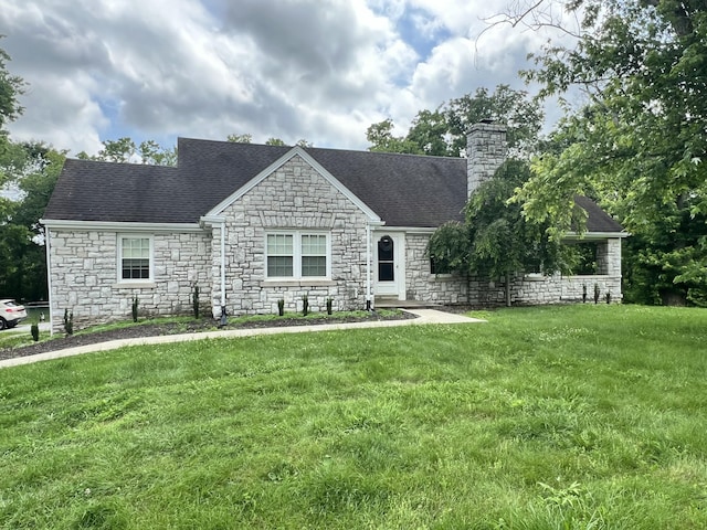 8585 Troy Pike, Versailles, KY 40383 - view of front of home featuring stone siding, a chimney, a front yard, and roof with shingles