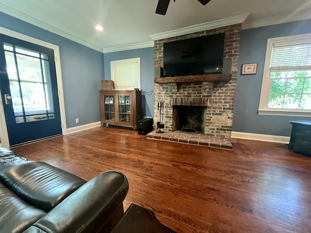 8585 Troy Pike, Versailles, KY 40383 - living room featuring wood finished floors, ornamental molding, a ceiling fan, and a brick fireplace