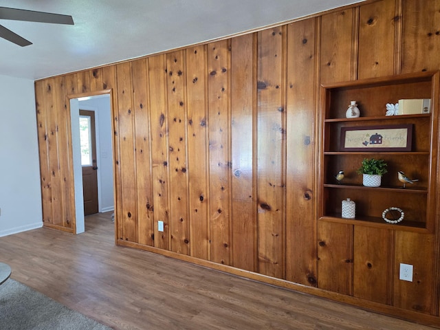 105 Kentucky Ave, Somerset, KY 42501 - empty room with wood finished floors, ceiling fan, and wooden walls