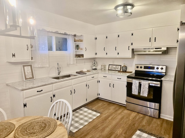 105 Kentucky Ave, Somerset, KY 42501 - kitchen featuring stainless steel range with electric stovetop, under cabinet range hood, wood finished floors, and white cabinetry