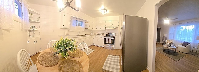 105 Kentucky Ave, Somerset, KY 42501 - kitchen with stainless steel appliances, under cabinet range hood, white cabinets, and light countertops