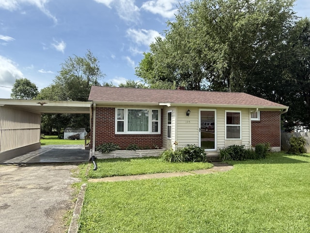 105 Kentucky Ave, Somerset, KY 42501 - single story home featuring driveway, a front lawn, an attached carport, and brick siding