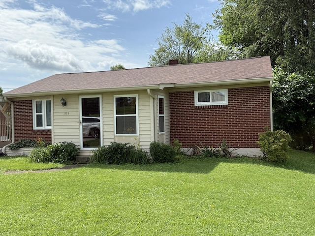 105 Kentucky Ave, Somerset, KY 42501 - view of front of home with a front lawn, brick siding, a chimney, and roof with shingles