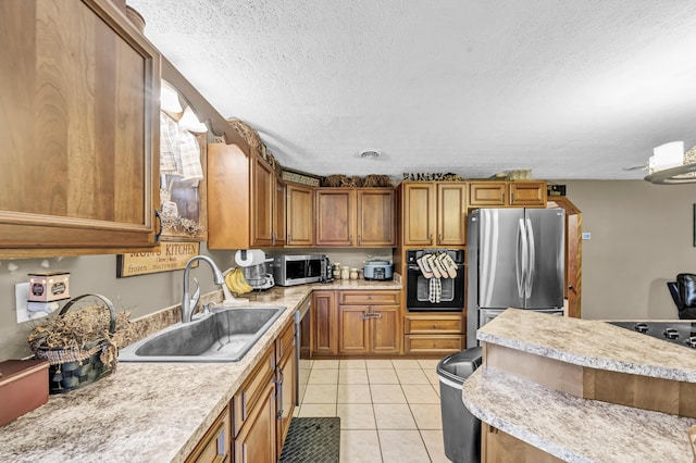 72 Blevins Ln, Vanceburg, KY 41179 - kitchen featuring stainless steel appliances, light countertops, brown cabinetry, light tile patterned flooring, and a textured ceiling