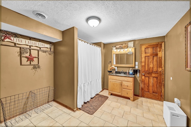 72 Blevins Ln, Vanceburg, KY 41179 - bathroom with vanity, a textured ceiling, curtained shower, and tile patterned floors