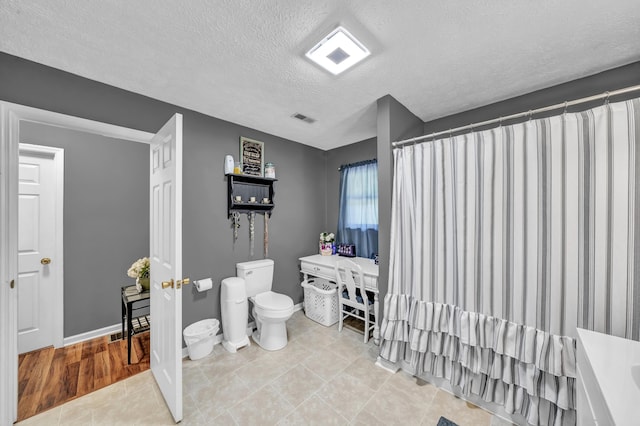 72 Blevins Ln, Vanceburg, KY 41179 - bathroom with a textured ceiling and a shower with shower curtain