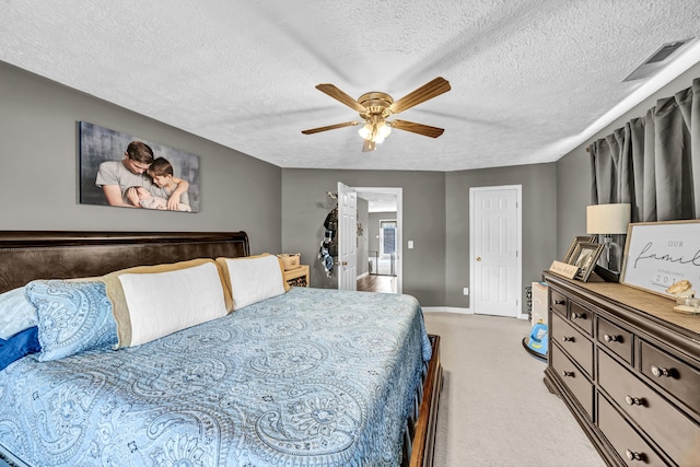 72 Blevins Ln, Vanceburg, KY 41179 - bedroom with light carpet, a textured ceiling, and a ceiling fan