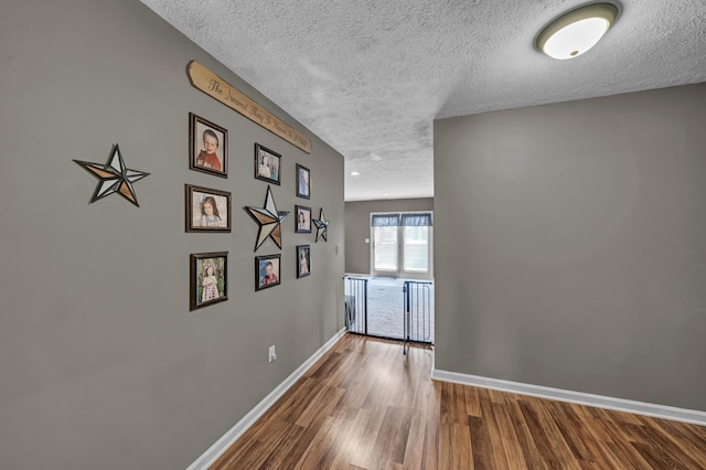 72 Blevins Ln, Vanceburg, KY 41179 - hall featuring a textured ceiling and wood finished floors