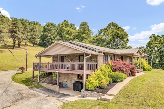 72 Blevins Ln, Vanceburg, KY 41179 - view of front facade featuring a front lawn, brick siding, and a patio area