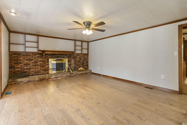 1751 Piney Grove Rd, Somerset, KY 42501 - unfurnished living room featuring ceiling fan, ornamental molding, light wood-type flooring, and a fireplace