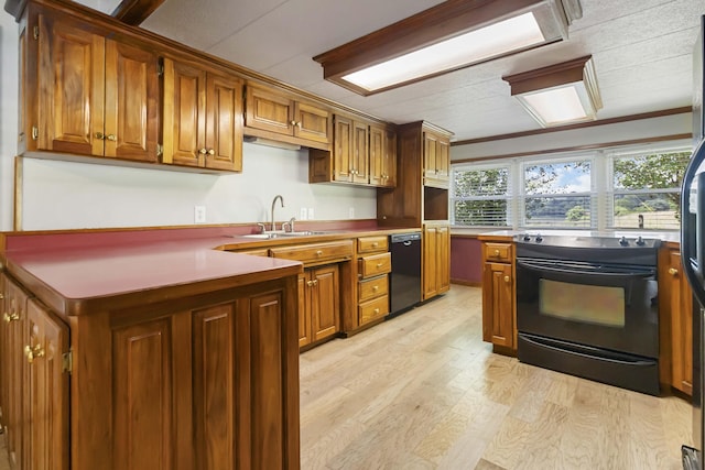 1751 Piney Grove Rd, Somerset, KY 42501 - kitchen featuring black appliances, brown cabinets, light wood-type flooring, and a peninsula