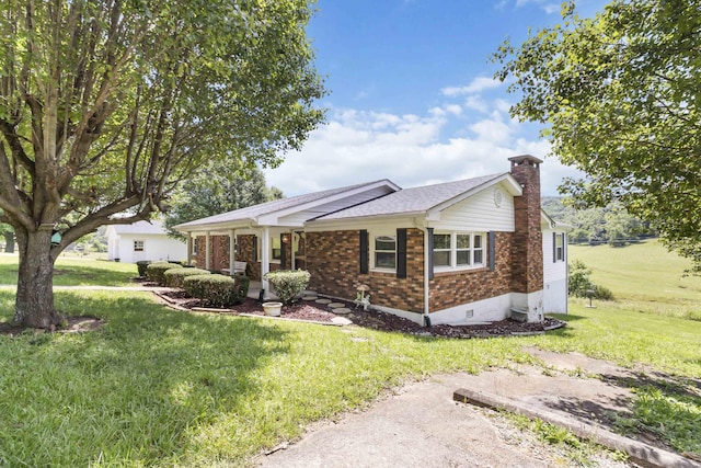 1751 Piney Grove Rd, Somerset, KY 42501 - single story home featuring a chimney, a front yard, brick siding, and covered porch