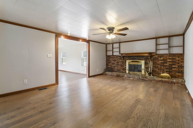 1751 Piney Grove Rd, Somerset, KY 42501 - unfurnished living room featuring crown molding, a ceiling fan, a brick fireplace, and wood finished floors