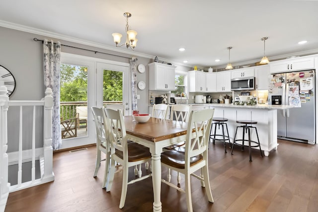81 Grand Crossing Ct, Somerset, KY 42503 - dining space with crown molding, dark wood-style floors, a chandelier, and recessed lighting