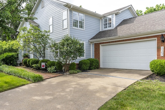 1107 Zoeller Ct, Lexington, KY 40511 - view of front of house featuring concrete driveway, brick siding, an attached garage, and a shingled roof