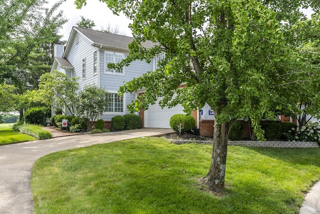 1107 Zoeller Ct, Lexington, KY 40511 - view of front facade with driveway, a front yard, a chimney, and a garage