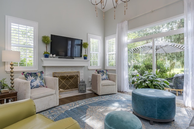 1107 Zoeller Ct, Lexington, KY 40511 - living area featuring wood finished floors, a fireplace, and a chandelier