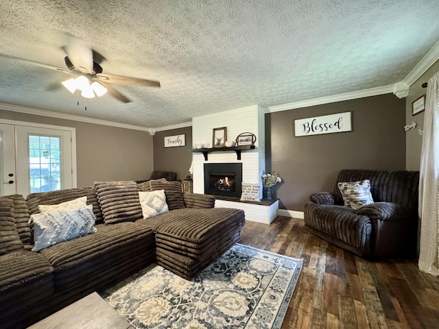 190 Keeneland Trl, Corbin, KY 40701 - living room with ceiling fan, hardwood / wood-style flooring, a textured ceiling, crown molding, and a fireplace