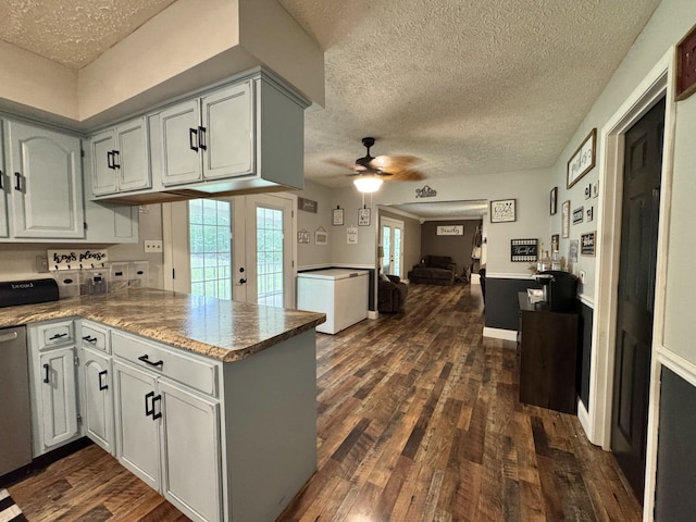 190 Keeneland Trl, Corbin, KY 40701 - kitchen with a peninsula, a textured ceiling, open floor plan, dark wood-type flooring, and ceiling fan
