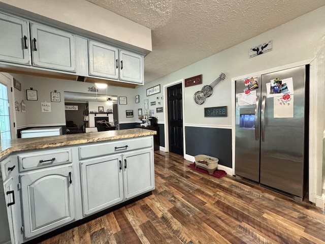 190 Keeneland Trl, Corbin, KY 40701 - kitchen featuring stainless steel fridge with ice dispenser, dark wood-type flooring, a textured ceiling, a peninsula, and gray cabinetry