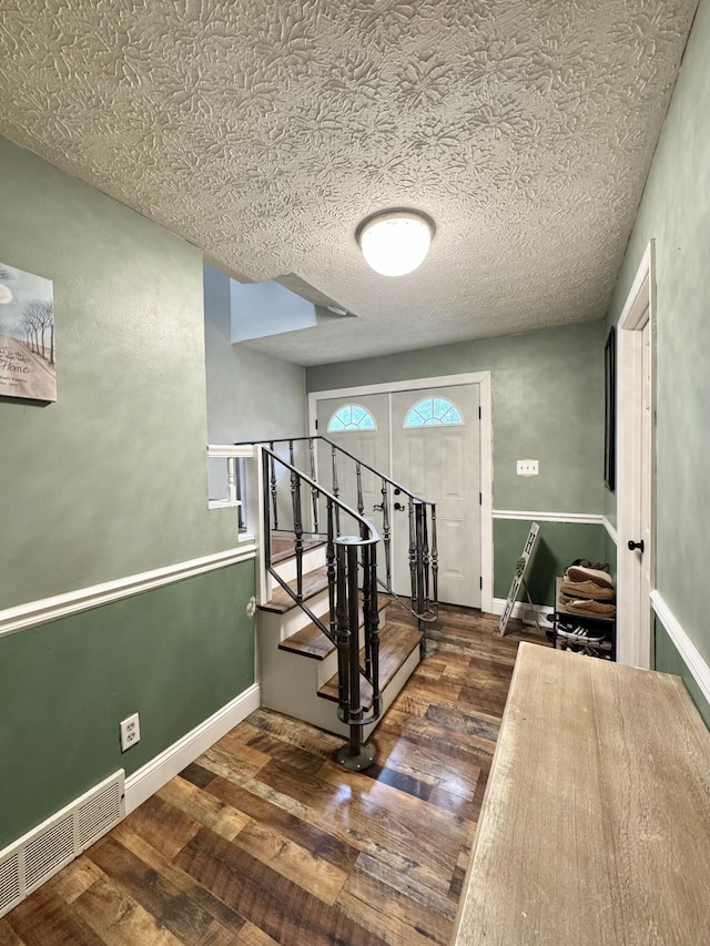 190 Keeneland Trl, Corbin, KY 40701 - entrance foyer featuring wood finished floors, stairs, and a textured ceiling