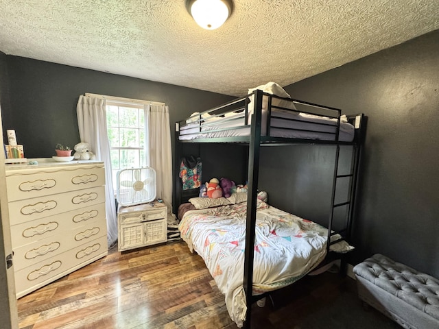 190 Keeneland Trl, Corbin, KY 40701 - bedroom with wood finished floors and a textured ceiling