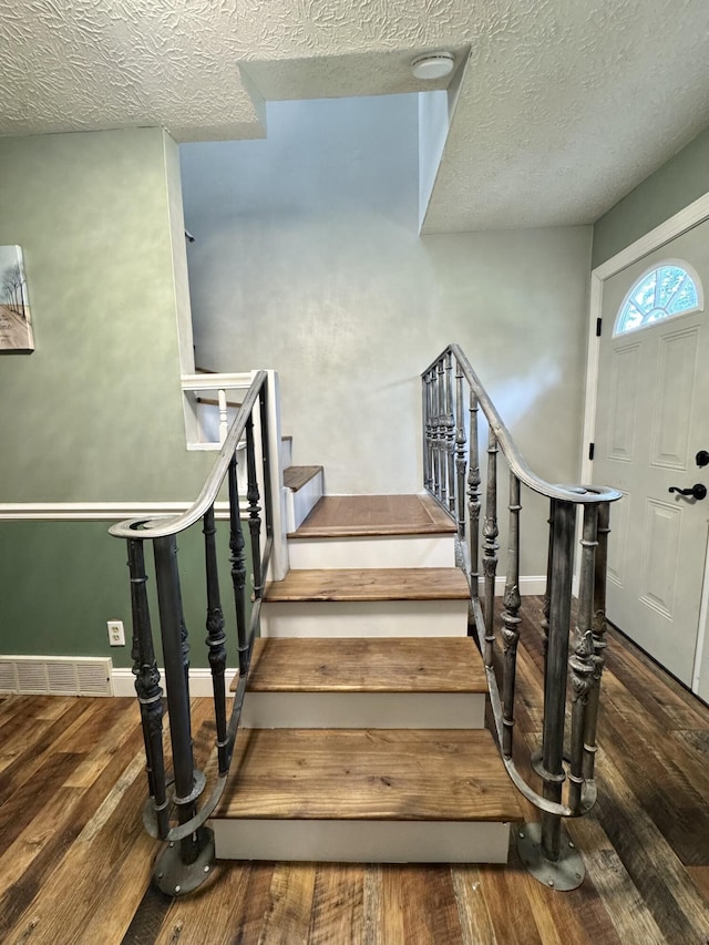 190 Keeneland Trl, Corbin, KY 40701 - stairway with wood finished floors and a textured ceiling