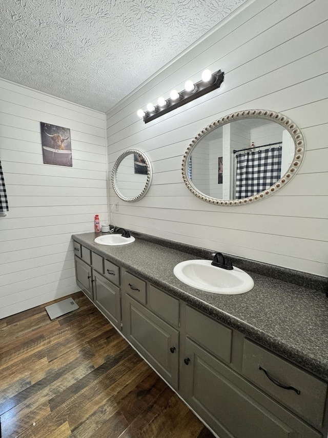 190 Keeneland Trl, Corbin, KY 40701 - full bathroom featuring double vanity, wood-type flooring, wooden walls, and a textured ceiling