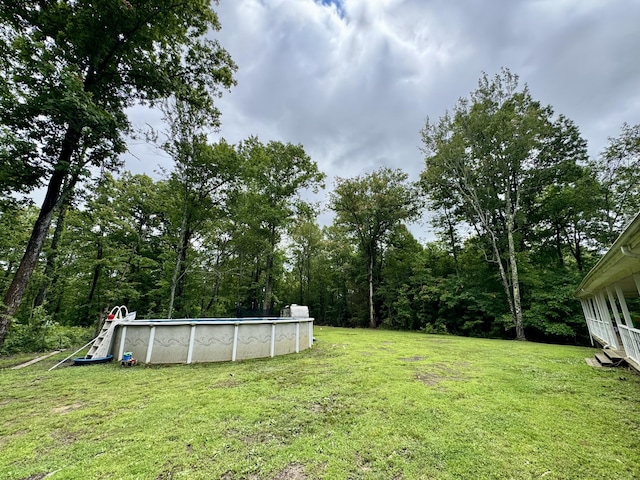 190 Keeneland Trl, Corbin, KY 40701 - view of green lawn with an outdoor pool
