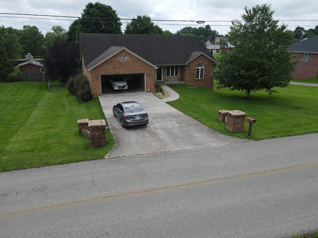 1459 Kit Cowan Rd, Somerset, KY 42501 - view of front of house with brick siding, a front lawn, concrete driveway, and a garage