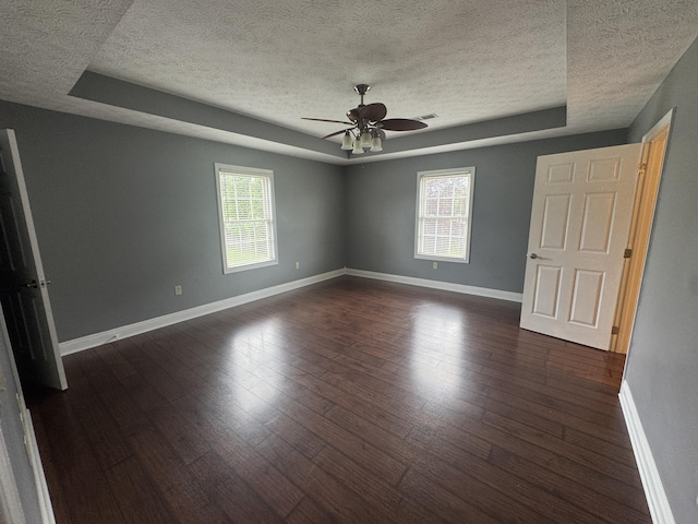 1459 Kit Cowan Rd, Somerset, KY 42501 - spare room with a textured ceiling, ceiling fan, plenty of natural light, and dark wood finished floors